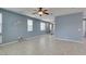 Expansive living room featuring tile floors, large windows, and recessed lighting at 1417 Brushback Ave, Henderson, NV 89074