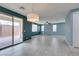 Living area with tile floors, recessed lighting, and backyard access through sliding doors at 1417 Brushback Ave, Henderson, NV 89074