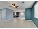 Open-concept living room featuring tile floors, recessed lighting, and view of the kitchen at 1417 Brushback Ave, Henderson, NV 89074