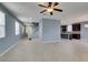 Bright living room with tile floors, recessed lighting, and staircase at 1417 Brushback Ave, Henderson, NV 89074