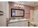 Bathroom with dual vanity, granite countertop, and shower-tub combo at 1575 W Warm Springs Rd # 413, Henderson, NV 89014