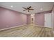 Bedroom with ceiling fan, wood floors and entry to ensuite bathroom at 1575 W Warm Springs Rd # 413, Henderson, NV 89014