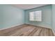 Bedroom featuring laminate floors and a window for natural light at 1575 W Warm Springs Rd # 413, Henderson, NV 89014