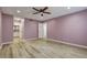 Spacious primary bedroom with ceiling fan, and wood-look flooring at 1575 W Warm Springs Rd # 413, Henderson, NV 89014