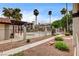 Inviting community pool with well-maintained landscaping and palm trees for a relaxing atmosphere at 1575 W Warm Springs Rd # 413, Henderson, NV 89014