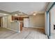 Inviting living space with new laminate floors and an adjoining kitchen with granite countertops at 1575 W Warm Springs Rd # 413, Henderson, NV 89014