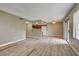 Open-concept living space with new flooring, a ceiling fan, and an adjoining kitchen area at 1575 W Warm Springs Rd # 413, Henderson, NV 89014