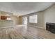 Spacious living room featuring modern flooring, neutral paint, and natural light from sliding glass door at 1575 W Warm Springs Rd # 413, Henderson, NV 89014