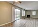Bright living room with wood floors, sliding glass doors, and a charming fireplace feature at 1575 W Warm Springs Rd # 413, Henderson, NV 89014
