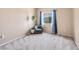 Cozy bedroom showcasing a comfortable chair, plant, and a window offering a view at 1604 Danielle Rebecca Ave, North Las Vegas, NV 89086