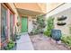 Inviting front porch featuring potted flowers and green front door at 1604 Danielle Rebecca Ave, North Las Vegas, NV 89086