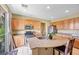 Kitchen featuring granite countertops, wood cabinets, stainless steel appliances, and a view through a glass door at 1604 Danielle Rebecca Ave, North Las Vegas, NV 89086