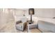 Cozy sitting area with comfortable chairs and a side table, perfect for relaxation at 1604 Danielle Rebecca Ave, North Las Vegas, NV 89086
