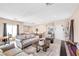 Spacious living room with comfortable seating, soft carpeting, and plenty of natural light at 1604 Danielle Rebecca Ave, North Las Vegas, NV 89086