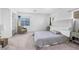 Spacious main bedroom with neutral paint, carpet, chair, shelving, and mountain views through the window at 1604 Danielle Rebecca Ave, North Las Vegas, NV 89086