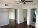 Bedroom features ceiling fan, closet, and adjoining bathroom at 1675 Jupiter Ct # C, Las Vegas, NV 89119
