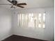 Bedroom with ceiling fan and window at 1675 Jupiter Ct # C, Las Vegas, NV 89119
