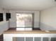 Bright living space with sliding glass doors, opening to the outdoors, with wood floors at 1675 Jupiter Ct # C, Las Vegas, NV 89119