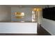 Inviting living area with a view into the kitchen, featuring access to the front door at 1675 Jupiter Ct # C, Las Vegas, NV 89119