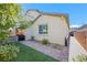 Landscaped backyard features manicured lawn, mature trees, and attractive hardscaping at 234 Polaris Ridge Ave, Henderson, NV 89011