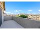 This is an empty balcony that has an expansive view of neighboring rooftops at 234 Polaris Ridge Ave, Henderson, NV 89011