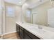 Elegant bathroom featuring double sinks, a large mirror, and plenty of counter space, designed for modern living at 234 Polaris Ridge Ave, Henderson, NV 89011