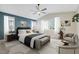 Stylishly furnished bedroom with vaulted ceiling, ceiling fan, and plantation shutters at 234 Polaris Ridge Ave, Henderson, NV 89011