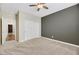 Cozy bedroom featuring soft carpet, a built-in closet, and a two-tone color scheme, ideal for relaxation and privacy at 234 Polaris Ridge Ave, Henderson, NV 89011