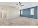 Large bedroom with plush carpeting, neutral walls, and two windows with shutters at 234 Polaris Ridge Ave, Henderson, NV 89011