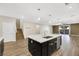 Bright, open kitchen features a large island with quartz countertops and stainless steel appliances at 234 Polaris Ridge Ave, Henderson, NV 89011