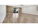 Expansive living room featuring wood-look floors and sliding glass doors to the backyard at 234 Polaris Ridge Ave, Henderson, NV 89011