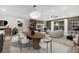 Spacious living room featuring modern furniture and a large sliding glass door at 234 Polaris Ridge Ave, Henderson, NV 89011