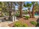 Outdoor BBQ area for resident's use, surrounded by beautiful landscaping and mature trees at 2606 S Durango Dr # 117, Las Vegas, NV 89117