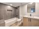 Contemporary bathroom with a tub, sleek vanity, modern mirror, and stylish fixtures at 2606 S Durango Dr # 117, Las Vegas, NV 89117