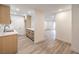 Updated living area featuring bright interiors and light gray flooring ready for new occupants at 2606 S Durango Dr # 117, Las Vegas, NV 89117