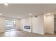 Bright living room featuring a modern fireplace and sliding glass doors to a balcony at 2606 S Durango Dr # 117, Las Vegas, NV 89117