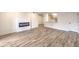 Open living space with modern fireplace and a view to the kitchen at 2606 S Durango Dr # 117, Las Vegas, NV 89117