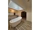Bright bathroom featuring a soaking tub, walk-in shower and dual sink vanity at 2637 Red Rock St # 202, Las Vegas, NV 89146