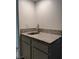 Bathroom sink featuring a granite countertop and gray cabinet at 2637 Red Rock St # 202, Las Vegas, NV 89146