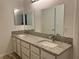 Bathroom featuring double sinks, granite countertops, and modern fixtures at 2637 Red Rock St # 202, Las Vegas, NV 89146