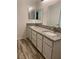 Bathroom featuring double sinks, granite countertops, and modern fixtures at 2637 Red Rock St # 202, Las Vegas, NV 89146