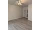 Bright bedroom featuring wood-look flooring, ceiling fan, and a double door closet at 2637 Red Rock St # 202, Las Vegas, NV 89146