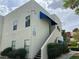 Angled view of a condo building, showcasing its architectural design and surrounding greenery at 2637 Red Rock St # 202, Las Vegas, NV 89146