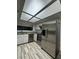 Bright kitchen featuring stainless steel appliances and ample white cabinetry at 2637 Red Rock St # 202, Las Vegas, NV 89146