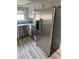 View of the kitchen featuring stainless steel appliances, modern countertops, and wood-look floors at 2637 Red Rock St # 202, Las Vegas, NV 89146