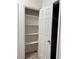 Linen closet features new white shelving and a white door at 2637 Red Rock St # 202, Las Vegas, NV 89146