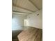 Bright, open living room with vaulted ceilings and wood-look flooring, offering a versatile living space at 2637 Red Rock St # 202, Las Vegas, NV 89146