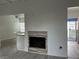 Bright living room featuring fireplace, neutral walls, and wood-look flooring at 2637 Red Rock St # 202, Las Vegas, NV 89146