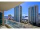 Balcony view showcasing high-rise buildings and the city skyline under a bright blue sky at 2777 Paradise Rd # 1701, Las Vegas, NV 89109