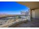 Balcony view highlighting the cityscape, including high-rise buildings, mountains, and a clear blue sky at 2777 Paradise Rd # 1701, Las Vegas, NV 89109
